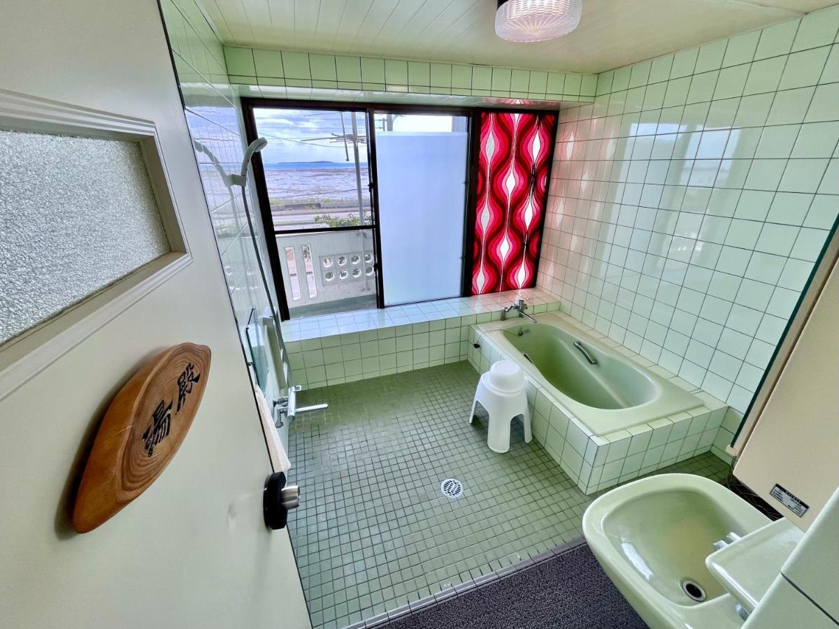 バーベキューもできる! 海と浜比嘉大橋を一望できる宿 Henza Exterior foto
